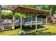 Covered boat lift providing secure storage for a boat on the water at 12110 Palmetto Ct, Dunnellon, FL 34432