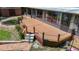 Large deck with chain railing and brick walkway offers backyard views and outdoor enjoyment at 12110 Palmetto Ct, Dunnellon, FL 34432