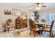 Cozy dining area featuring tropical decor, a buffet cabinet and ample seating for gatherings at 12110 Palmetto Ct, Dunnellon, FL 34432