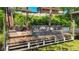 Waterfront dock featuring a fire pit and seating area, perfect for enjoying the beautiful view at 12110 Palmetto Ct, Dunnellon, FL 34432