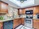 This kitchen features granite countertops, and modern stainless steel appliances, under bright lighting at 12110 Palmetto Ct, Dunnellon, FL 34432