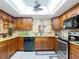 This kitchen features granite countertops, and modern stainless steel appliances, under bright lighting at 12110 Palmetto Ct, Dunnellon, FL 34432