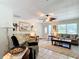 Inviting living room with tile floors, a ceiling fan and windows that provide natural light at 12110 Palmetto Ct, Dunnellon, FL 34432