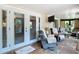 Relaxing sunroom with recliners and access to the outdoors at 12110 Palmetto Ct, Dunnellon, FL 34432