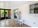 Bright sunroom with tile floors, and sliding doors at 12110 Palmetto Ct, Dunnellon, FL 34432
