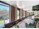 Bright sunroom with sliding doors and scenic outdoor views at 12110 Palmetto Ct, Dunnellon, FL 34432