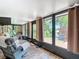 Cozy sunroom featuring comfortable seating and scenic views at 12110 Palmetto Ct, Dunnellon, FL 34432