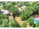 Aerial view of a home, showcasing the yard and mature trees in a suburban neighborhood at 12346 Lake Valley Dr, Clermont, FL 34711
