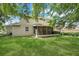 Expansive backyard with lush green lawn and mature trees at 12346 Lake Valley Dr, Clermont, FL 34711