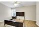 Bedroom featuring wood laminate flooring and a contemporary bed frame at 12346 Lake Valley Dr, Clermont, FL 34711