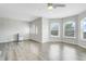 Spacious bedroom featuring lots of windows, light gray flooring, and a ceiling fan at 12346 Lake Valley Dr, Clermont, FL 34711