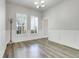 Formal dining room with white trim, wood floors and lots of natural light at 12346 Lake Valley Dr, Clermont, FL 34711