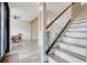 View of the staircase and dining room from the entryway showcasing an open floorplan with light hardwood floors at 12346 Lake Valley Dr, Clermont, FL 34711