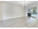 Bright living room featuring light gray flooring, recessed lighting, and sliding glass doors at 12346 Lake Valley Dr, Clermont, FL 34711