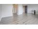 Living area featuring light gray flooring, a mini refrigerator, and a bright atmosphere at 12346 Lake Valley Dr, Clermont, FL 34711