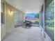 Outdoor kitchen featuring built-in grill on a screened porch at 12346 Lake Valley Dr, Clermont, FL 34711