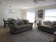Inviting living room with comfortable seating and an adjacent dining area at 1420 Fairway St, The Villages, FL 32162