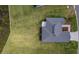 Aerial view of the home and roof, surrounded by expansive, well-manicured lawn at 1422 Jeremy Cir, The Villages, FL 34762