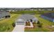 Beautiful aerial view of a gray single-story home with manicured landscaping in a peaceful neighborhood at 1422 Jeremy Cir, The Villages, FL 34762