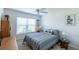 Comfortable bedroom with a ceiling fan, a large window, and a relaxed atmosphere at 1422 Jeremy Cir, The Villages, FL 34762