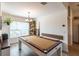 Charming dining area featuring a billiard table, and natural light from the window at 1422 Jeremy Cir, The Villages, FL 34762