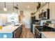 Stylish kitchen featuring stainless steel appliances, a gas range, and sleek countertops at 1422 Jeremy Cir, The Villages, FL 34762