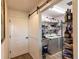 Convenient laundry room featuring a washer, dryer, utility sink, and ample storage shelving at 1422 Jeremy Cir, The Villages, FL 34762