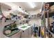The functional laundry room offers plenty of shelving for storage and organization at 1422 Jeremy Cir, The Villages, FL 34762