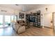 Cozy living room featuring modern furniture, a ceiling fan, and sliding glass doors at 1422 Jeremy Cir, The Villages, FL 34762