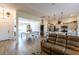 Open-concept living space with a kitchen, living room and a dining area with a billiard table at 1422 Jeremy Cir, The Villages, FL 34762