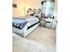 Well-lit bedroom features a workspace and neutral carpet at 14536 Sw 34Th Terrace Rd, Ocala, FL 34473
