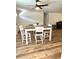Open dining room space with hardwood floors and a dining table with seating for four at 14536 Sw 34Th Terrace Rd, Ocala, FL 34473