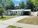 Lovely one-story home featuring a covered carport, well-kept lawn, and inviting front entrance at 14536 Sw 34Th Terrace Rd, Ocala, FL 34473