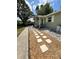 Charming single-story home with stepping stones leading to a cozy front porch at 14536 Sw 34Th Terrace Rd, Ocala, FL 34473