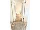 Inviting hallway with hardwood flooring leading to a bright, open living space at 14536 Sw 34Th Terrace Rd, Ocala, FL 34473