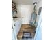 Functional utility room featuring laundry hookups and water heater at 14536 Sw 34Th Terrace Rd, Ocala, FL 34473