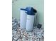 Westinghouse water softener with dual tanks sitting on top of a bed of white gravel at 14536 Sw 34Th Terrace Rd, Ocala, FL 34473