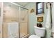 Bathroom features a shower with sliding glass doors and a modern toilet at 1639 W Schwartz Blvd, The Villages, FL 32159