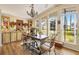 Bright dining room with large windows and stylish chandelier at 1639 W Schwartz Blvd, The Villages, FL 32159