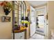 Welcoming foyer features a large mirror and view to the outdoor patio at 1639 W Schwartz Blvd, The Villages, FL 32159