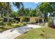 Well-manicured front lawn with a paved drive and parking space at 1639 W Schwartz Blvd, The Villages, FL 32159