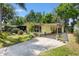 Charming single story home featuring a well manicured lawn, covered entryway, and driveway at 1639 W Schwartz Blvd, The Villages, FL 32159