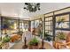 Bright sunroom with a view of a bar area and glass windows and doors at 1639 W Schwartz Blvd, The Villages, FL 32159