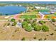Aerial view displays the property's location near a lake, athletic fields, and surrounding neighborhoods at 16724 Highland Ave, Montverde, FL 34756