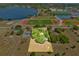 Aerial view highlights property boundaries, showcasing proximity to lake and athletic fields at 16724 Highland Ave, Montverde, FL 34756