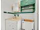 Classic bathroom with a vintage vanity, tiled walls, and green accents at 16724 Highland Ave, Montverde, FL 34756