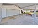 Spacious garage with covered carport and adjacent outdoor seating area at 16724 Highland Ave, Montverde, FL 34756