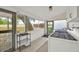 Enclosed porch includes laundry machines and view to the outside at 16724 Highland Ave, Montverde, FL 34756