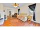 Spacious living room featuring hardwood floors, fireplace, and an open layout with ample natural light at 16724 Highland Ave, Montverde, FL 34756