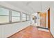 Bright sun room featuring wood floors and several large windows at 16724 Highland Ave, Montverde, FL 34756